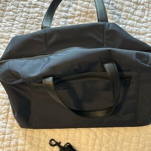 Gently used Navy Blue Away Everywhere Bag